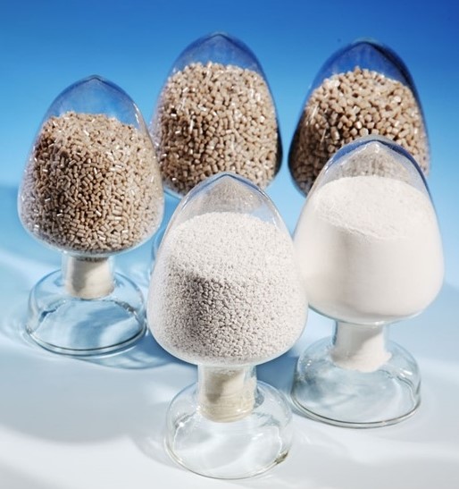 CoPEEK powder and granules in a glass. BIEGLO GmbH